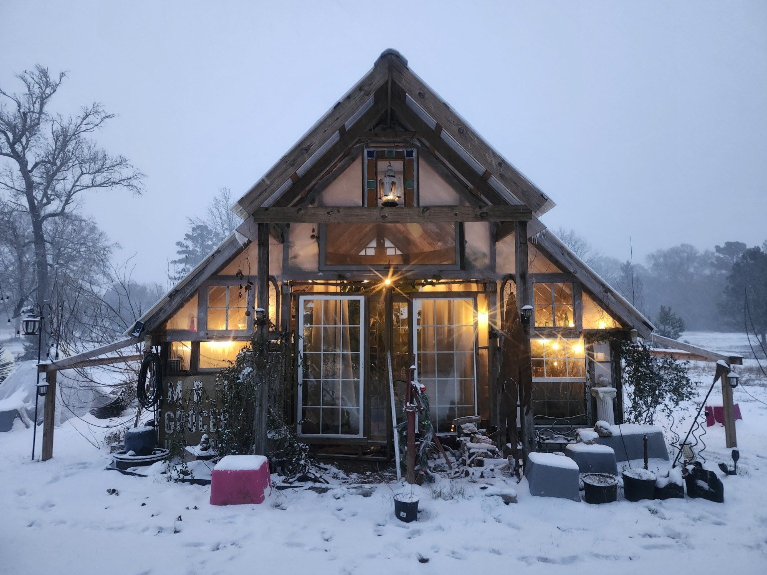 The greenhouse glowing in the snow